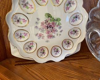 White china deviled egg tray with delicate flowers in violet