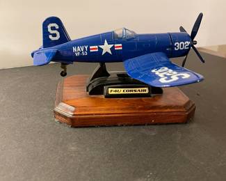 F4U Corsair model Navy plane on mahogany stand.