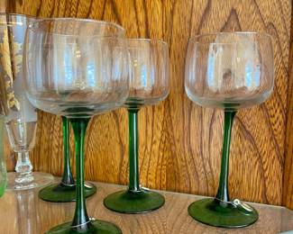 Green stemmed red wine glasses