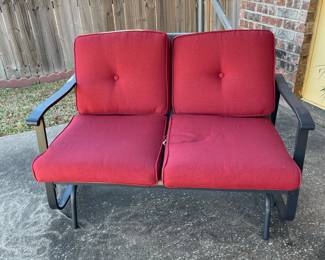 Patio love seat with red cusions