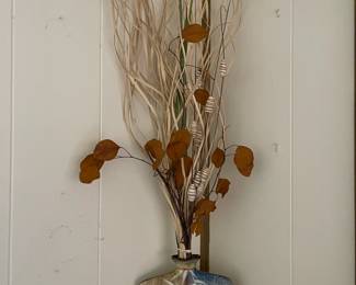 Dried flower arrangement in an Asian inspired vase