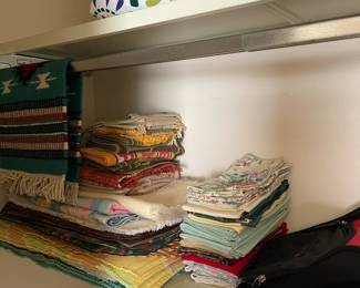 Many colorful table napkins and table cloths.