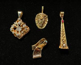 Left  14k and diamonds , top center 14k, right 14k, Bottom center 10k.  All pendants.