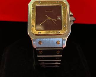 Vintage Cartier Santos with a burgundy face. Has registration card.