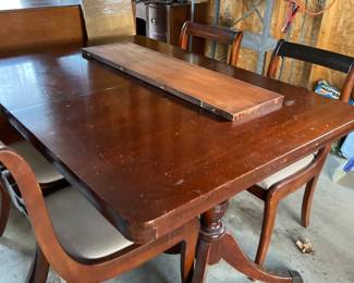 Antique dining table and chairs.