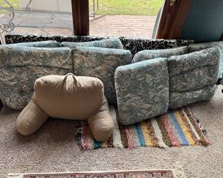 Upholstery for patio chairs in very good condition; colorful woven rug.