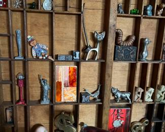 Vintage letterpress drawers with a fun selection of miniatures.