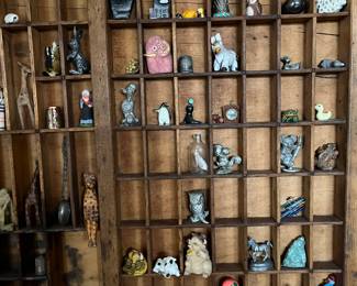 Vintage letterpress drawers with a fun selection of miniatures.