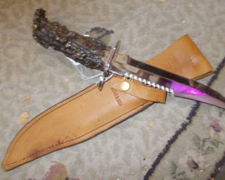 Hand crafted stag handle knife and sheath. PINK is only a reflection, knife is in perfect condition