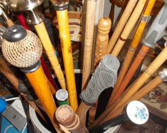 Numerous modified or carved walking canes