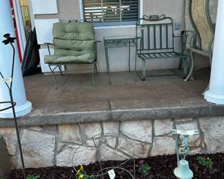 wrought iron table and 2 chairs