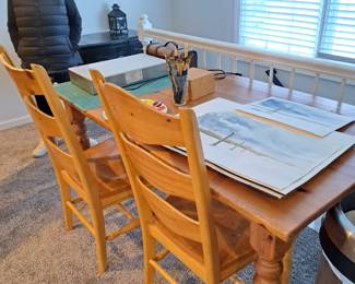 Pine table; ladder back chairs