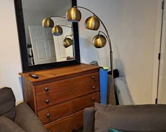 Pine chest, four-drawer, antique;
Beveled mirror
Brass floor lamp, cluster shades