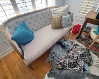 Tufted back sofa with curved sides