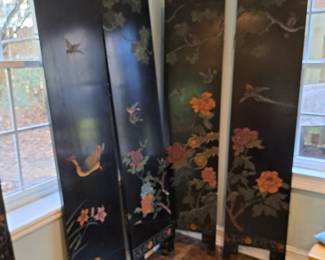 Four of six of the panels of lacquered screen