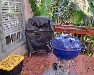 Weber grill; pizza oven in background