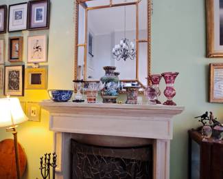 Panelled mirror in urn and floral details