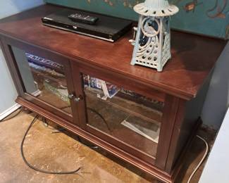 Double door stand with storage for games, DVDs, CDs, etc.