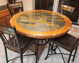 Lovely Kitchen Table with custom glass top. Table is wood and tile. Chairs are metal and upholstered. Gently used. $125 OBO. Must go Sunday!