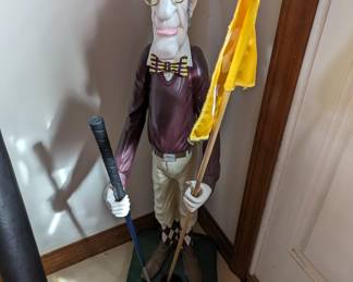 Charming golfer statue 