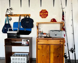 Oak cabinet, fishing poles, fishing equip