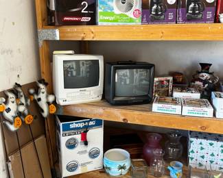 New in box coffee machines, fan. Vases, box tv's. Shop Vac