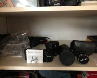 Several vintage cameras and lenses