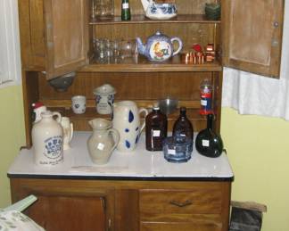 Hoosier cabinet with vintage bottles and other items for Estate Sale