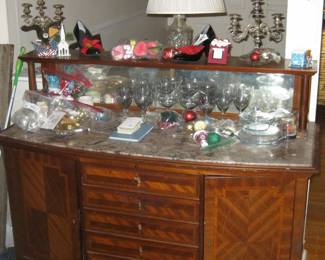 Piece of Austrian furniture with glasses and various other items for Estate Sale on it