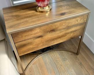$650 - Caracole nightstand #2 - 29.5" H, 33" W, 18" D - Made from fumed cluster oak featuring two touch-latch drawers and a top that flips up to reveal an outlet. Concealed light on nightstand's underside.