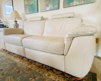 leather modular Natuzzi sofa, reclines, removable head rests