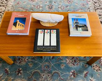 has book storage shelf hidden below, giant grasshopper