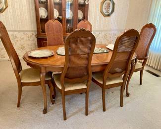 French Provincial dining table with 6 cane back chairs