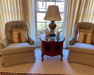 pair of sage green and white striped club chairs, French Provincial end table, brass lamp, pair of bird figurines