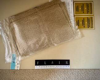 2 off-white Bernhardt sofas with wood trim and over-sized coffee table