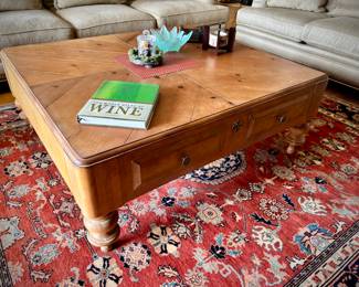 2 off-white Bernhardt sofas with wood trim and over-sized coffee table