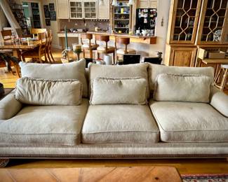 2 off-white Bernhardt sofas with wood trim and over-sized coffee table