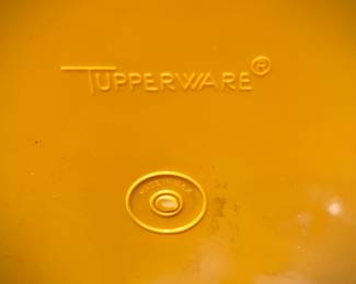 Full, unused tupperware container filled with smaller Tupperware pieces - in original plastic