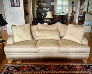 2 off-white Bernhardt sofas with wood trim and over-sized coffee table