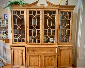 Wood breakfront with hidden pull-out desk