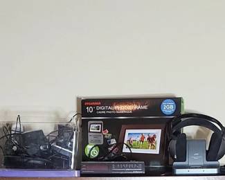 Sylvania 10" Digital Photo Frame, Emerson AM/FM Clock Radio, JVC Cordless Headphones & more. (LPO)