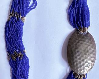 Vintage Beaded Torsade Necklace With Hammered Metal
Lot #: 70