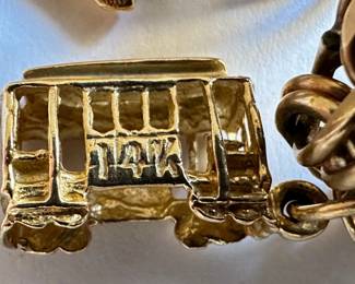 Vintage 18 Karat Gold Rhythm Jewelry Charm Bracelet With 7 Charms: Charms Mostly 14 Karat Gold Or Sterling
Lot #: 38