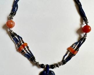 Beaded Necklace With Large Carved Lapis Leaf Pendant
Lot #: 53