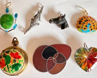 7 Vintage Pendants: Locket, Articulated Alligator, Horse & More
Lot #: 125