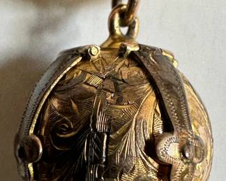 9 Karat Gold Globe Pendant On Chain, Opens To Reveal Etched Symbols
Lot #: 37