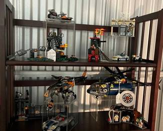 Lego Agents Swamp Raid ($38), Vintage Lego Dragon Wagon 6056 ($24), Lego Spiderman Bank Robber 4854 ($40) Lower Shelf: Lego Agents 8634 Turbo Car Chase 99% Complete ($60), Lego Agents 8971 Defense Unit Helicopter And Anti-Aircraft Unit With 7 Minis ($95) 