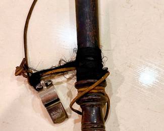 Vintage police billy club and whistle.