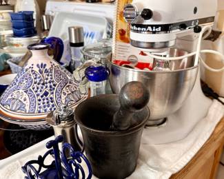 KitchenAid  mixer with attachments, antique mortar and pestle.