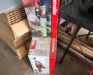 Brand new Homelite electric chain saw.